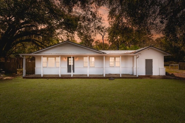181 E Center St, Perry, FL 32348 - ranch-style home featuring covered porch and a yard
