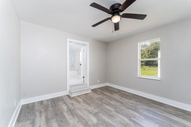 181 E Center St, Perry, FL 32348 - unfurnished room featuring wood finished floors and a ceiling fan