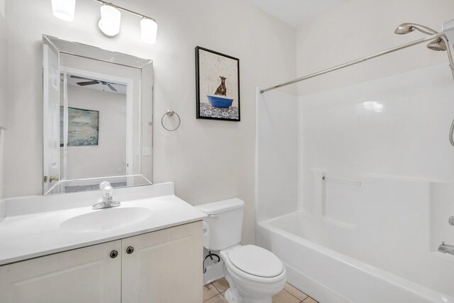 full bathroom featuring tile patterned floors, vanity,  shower combination, and toilet