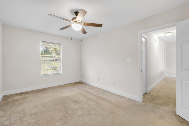 carpeted empty room with ceiling fan