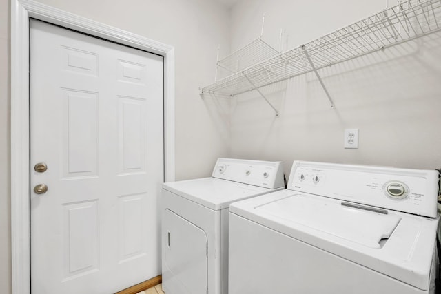 laundry area with independent washer and dryer