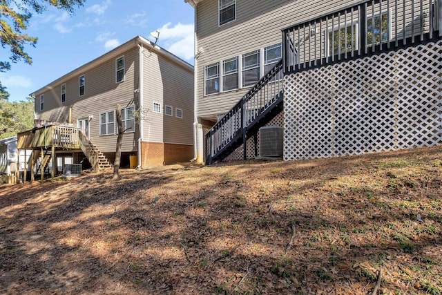 back of property featuring cooling unit