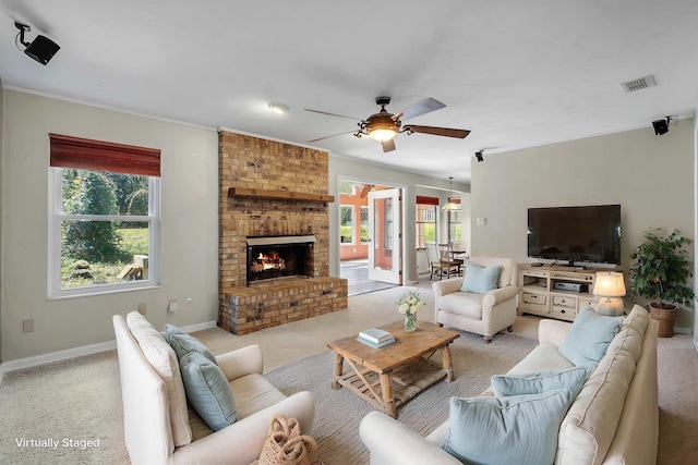 living room featuring light carpet, a brick fireplace, ceiling fan, and visible vents