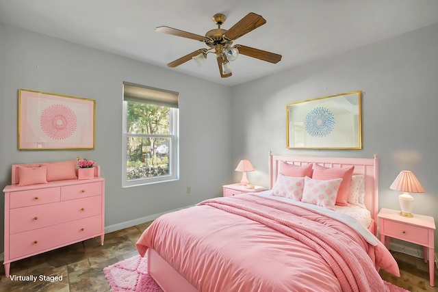 bedroom featuring baseboards and a ceiling fan