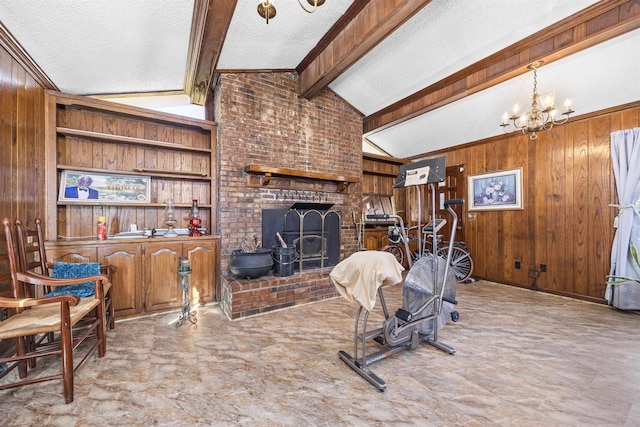 living room featuring a wood stove, wooden walls, vaulted ceiling with beams, a textured ceiling, and a notable chandelier