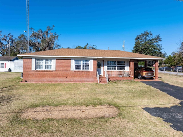 single story home with a carport and a front yard