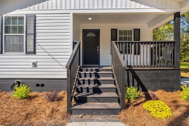 property entrance featuring covered porch