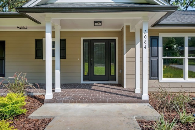 property entrance with covered porch