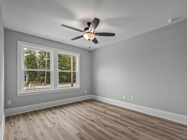 unfurnished room featuring ceiling fan and light wood-type flooring