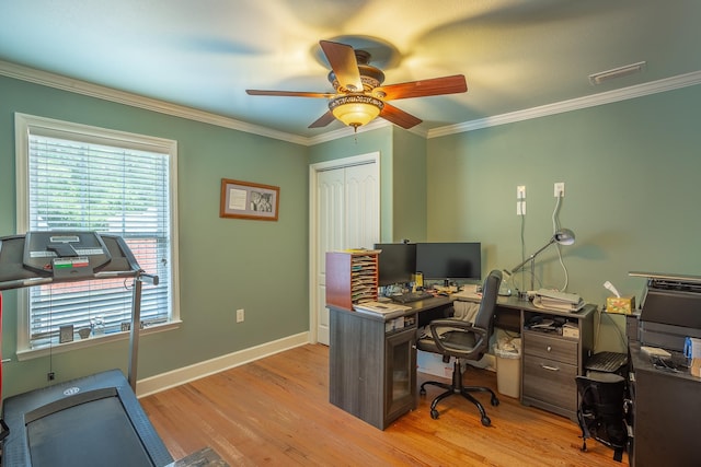 office with plenty of natural light, ceiling fan, crown molding, and light hardwood / wood-style flooring