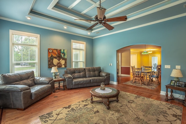 living room featuring crown molding, plenty of natural light, ceiling fan, and light hardwood / wood-style flooring