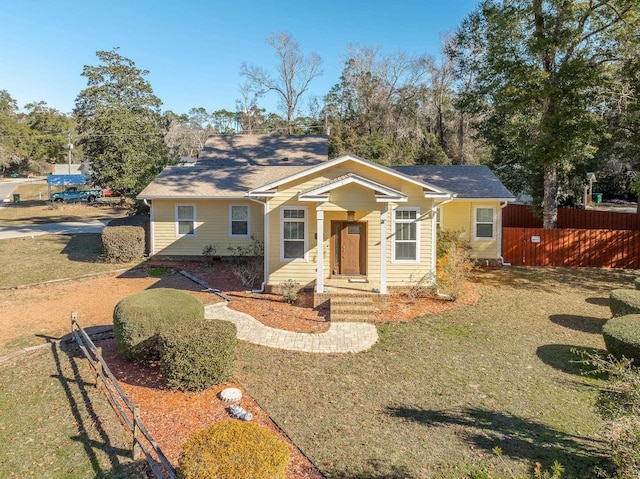 bungalow-style house featuring a front lawn