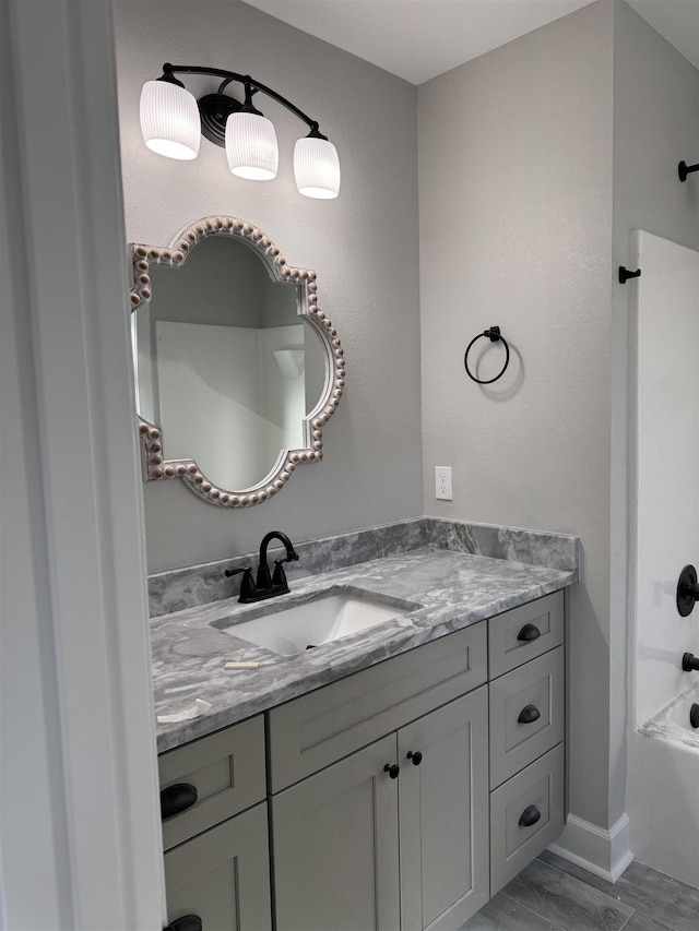 bathroom featuring vanity and shower / bathtub combination