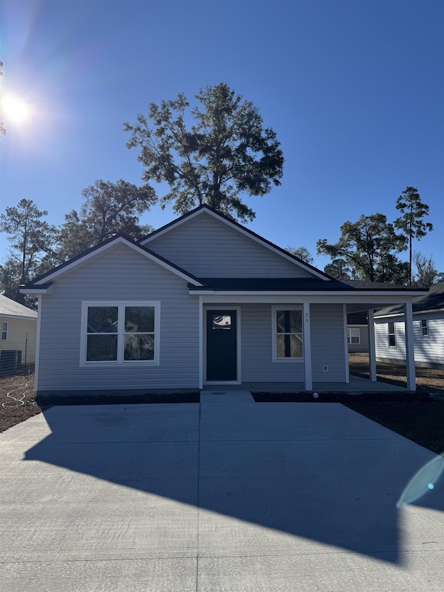 view of front of home with a carport