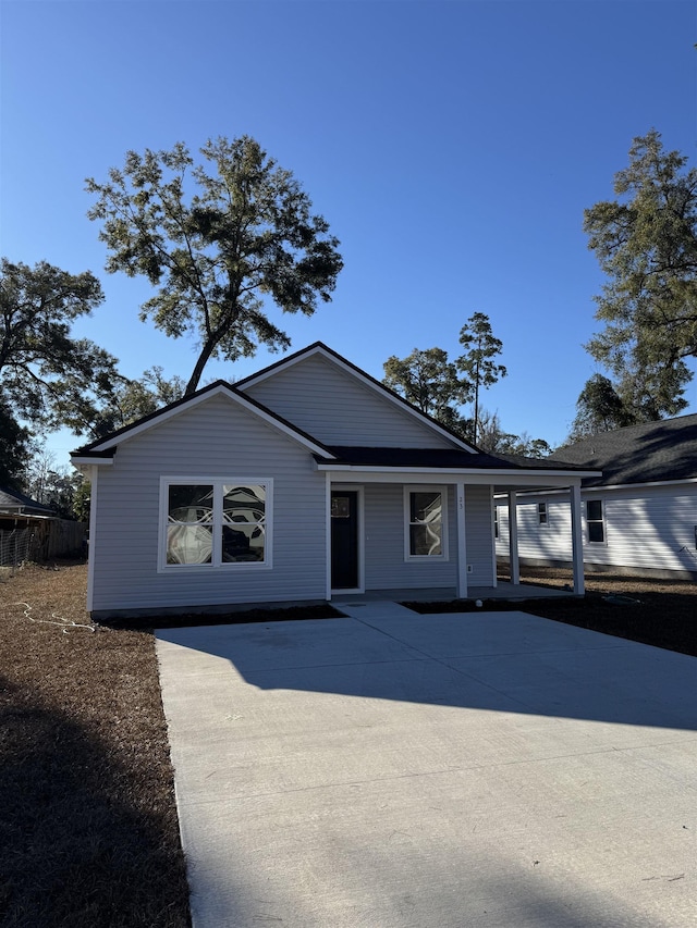 view of front of property featuring a carport