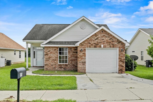 view of front of house with a garage and a front yard