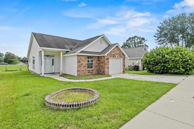 view of front of home with a garage and a front lawn