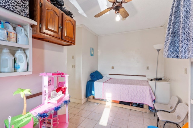 bedroom with light tile patterned floors, ceiling fan, and baseboards