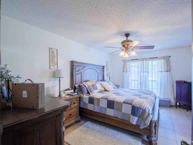 181 NE Biltmore Rd, Madison, FL 32340 - bedroom with ceiling fan, light tile patterned floors, and a textured ceiling