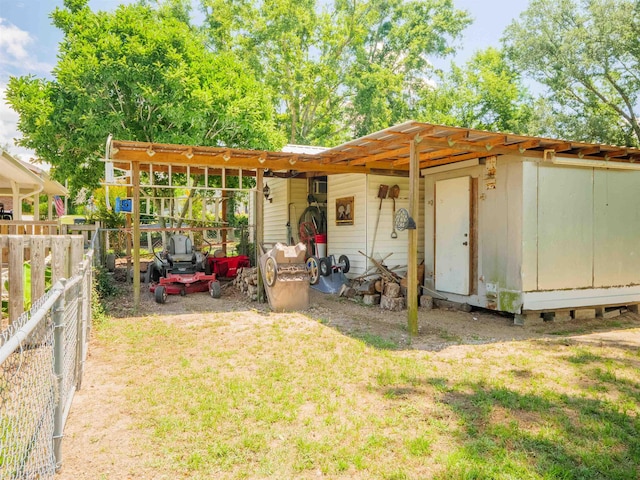 181 NE Biltmore Rd, Madison, FL 32340 - rear view of house featuring an outbuilding