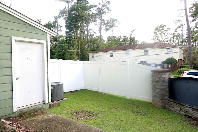 view of yard with central AC unit