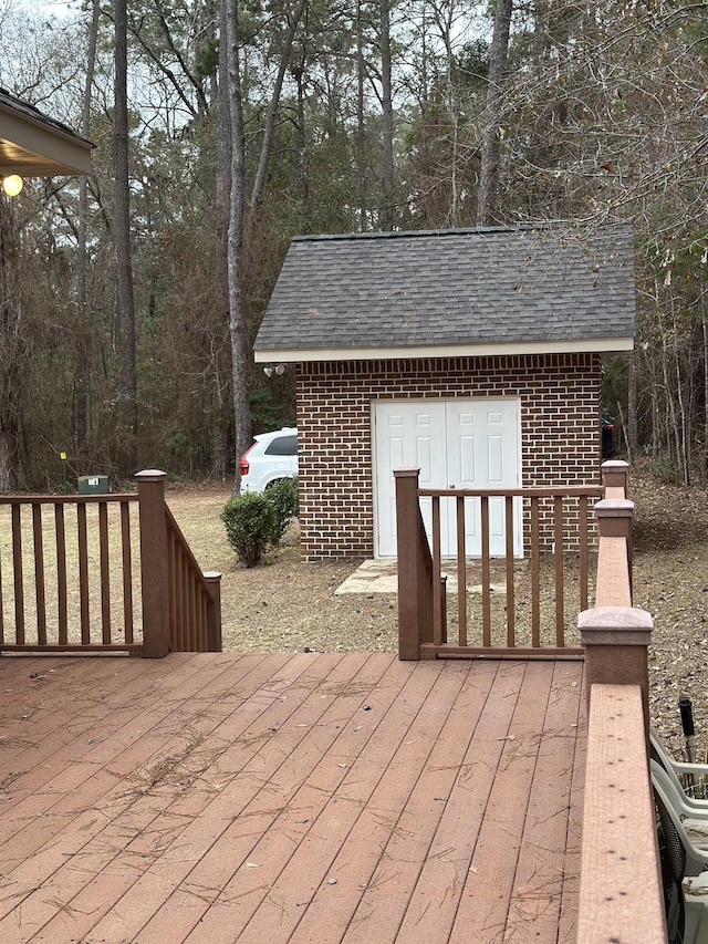 wooden deck featuring an outdoor structure