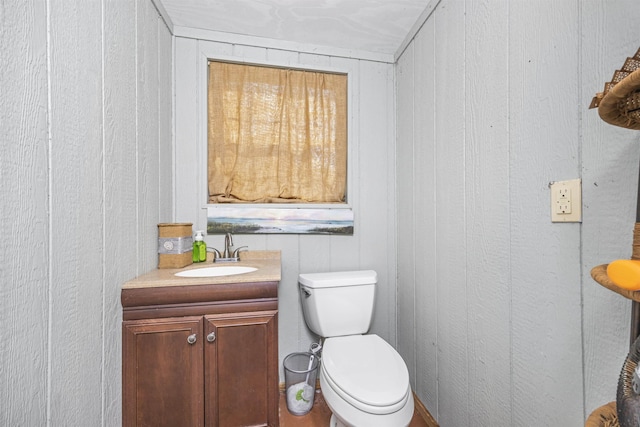 bathroom with toilet and vanity