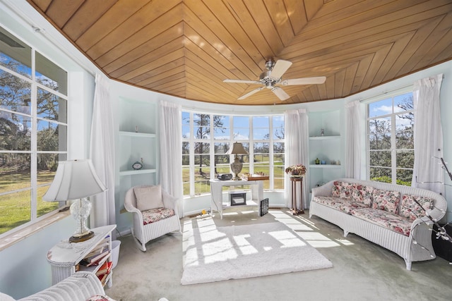 sunroom / solarium with wooden ceiling and ceiling fan