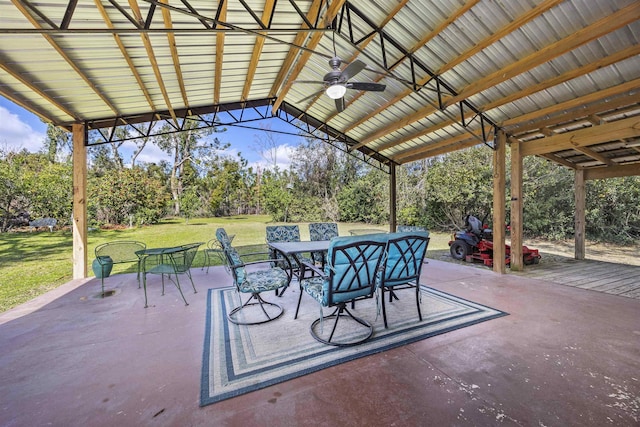 view of patio featuring outdoor dining area and a ceiling fan