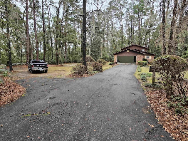 view of road with aphalt driveway