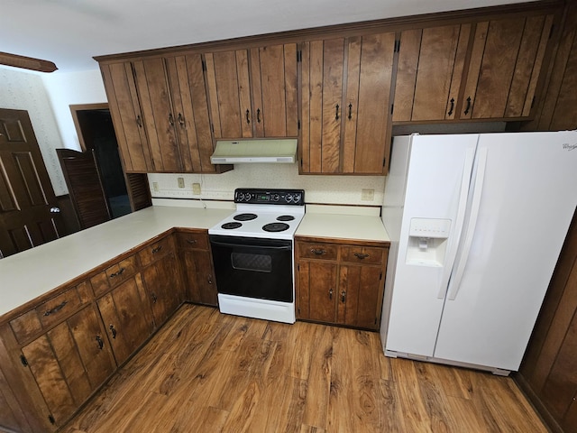 kitchen featuring white refrigerator with ice dispenser, light countertops, electric range, light wood-style floors, and under cabinet range hood