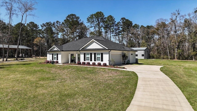 modern farmhouse style home with a garage, board and batten siding, concrete driveway, and a front yard