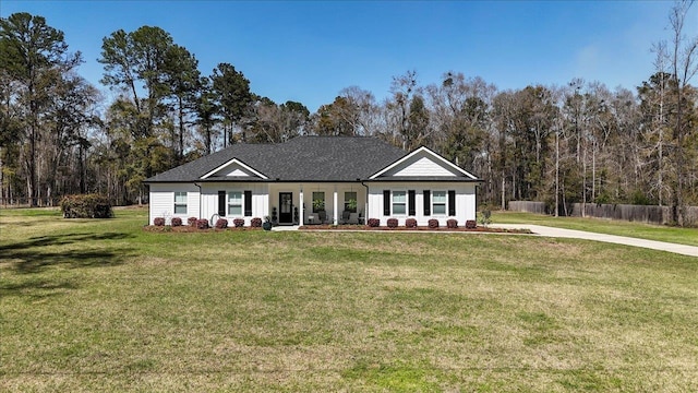 view of front of house featuring a front yard and fence