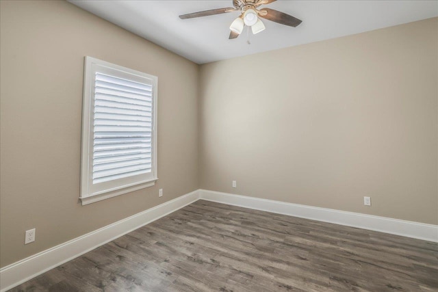 empty room with wood finished floors, baseboards, and ceiling fan