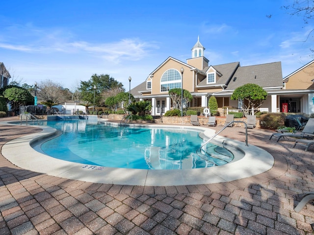 view of swimming pool featuring a patio