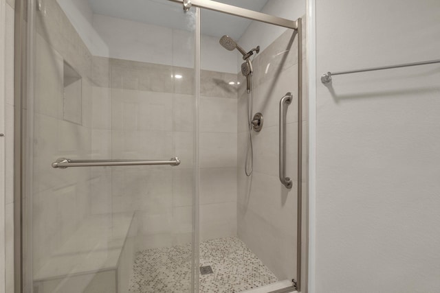 bathroom featuring an enclosed shower