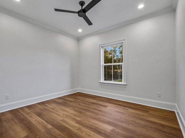 empty room featuring ceiling fan, wood-type flooring, and ornamental molding