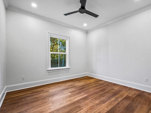 empty room with ceiling fan, crown molding, and wood-type flooring