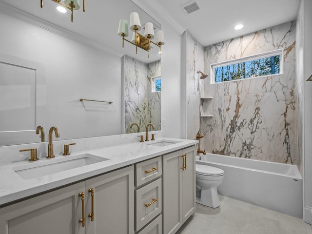 full bathroom with toilet, tiled shower / bath, vanity, and crown molding