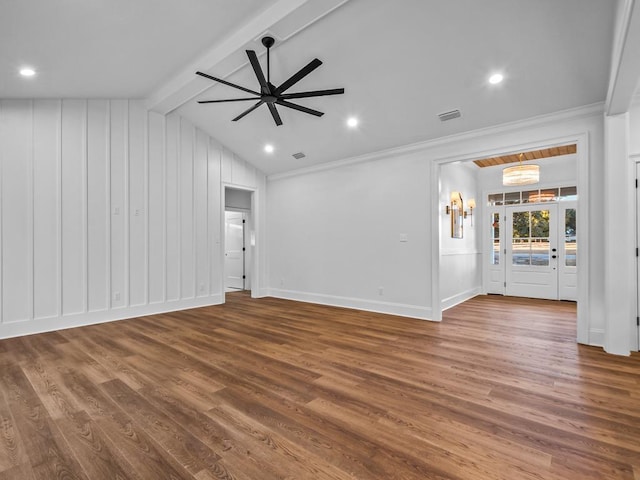 unfurnished living room with ceiling fan, vaulted ceiling with beams, crown molding, and hardwood / wood-style floors