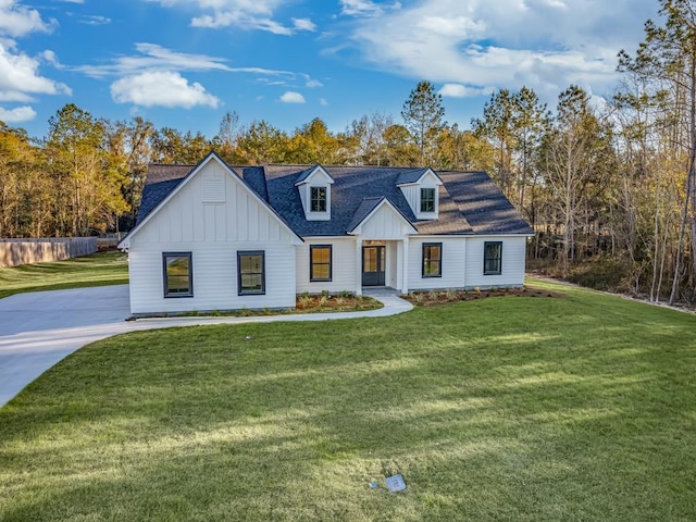 modern inspired farmhouse with a front yard