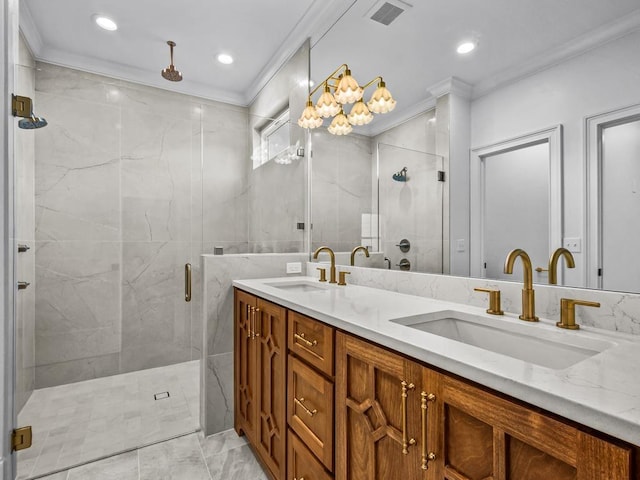 bathroom with ornamental molding, a shower with shower door, and vanity