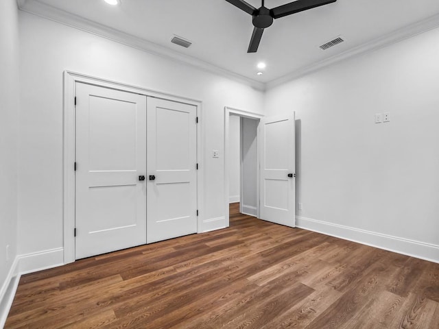 unfurnished bedroom with ceiling fan, a closet, and dark hardwood / wood-style flooring