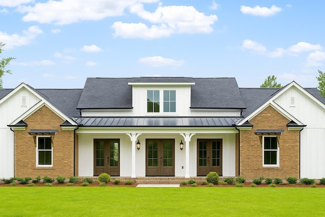 2727 Chaires Cross Rd, Tallahassee, FL 32317 - modern inspired farmhouse with french doors, a standing seam roof, a front lawn, covered porch, and a shingled roof
