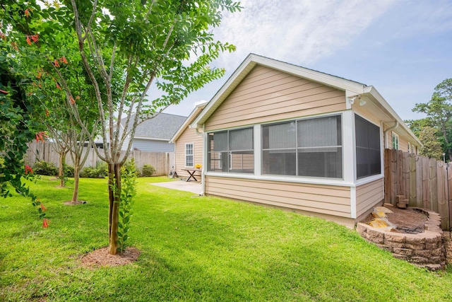 9321 Royal Troon Dr, Tallahassee, FL 32312 - back of property with a patio area and a sunroom