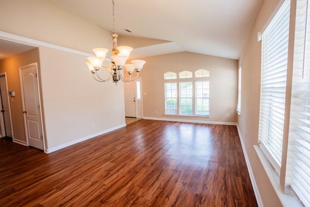 9321 Royal Troon Dr, Tallahassee, FL 32312 - empty room with a chandelier, dark wood finished floors, vaulted ceiling, and baseboards