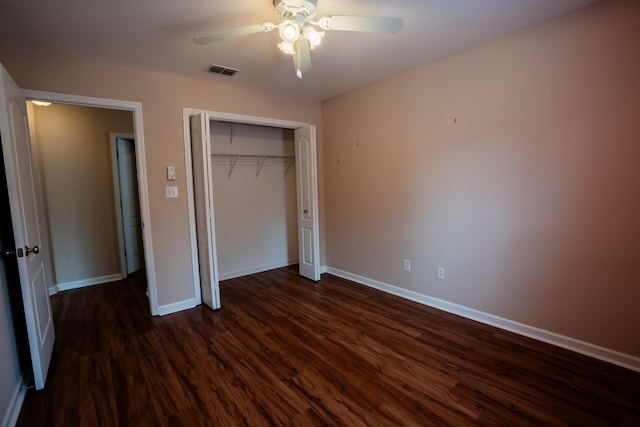 9321 Royal Troon Dr, Tallahassee, FL 32312 - unfurnished bedroom featuring dark wood-style flooring, baseboards, a closet, and a ceiling fan