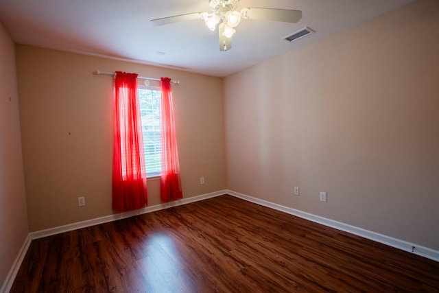 9321 Royal Troon Dr, Tallahassee, FL 32312 - empty room with a ceiling fan, dark wood-style floors, and baseboards