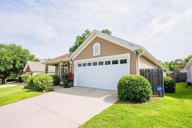 9321 Royal Troon Dr, Tallahassee, FL 32312 - ranch-style home featuring a garage, driveway, and stucco siding