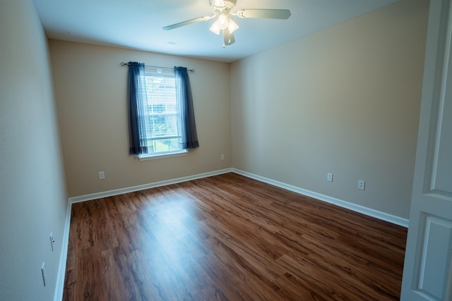 9321 Royal Troon Dr, Tallahassee, FL 32312 - empty room with dark wood-style floors, a ceiling fan, and baseboards